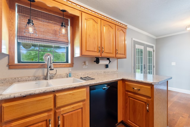 kitchen with dishwasher, pendant lighting, crown molding, hardwood / wood-style floors, and sink