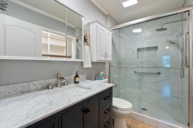 bathroom with walk in shower, vanity, tile patterned flooring, and toilet