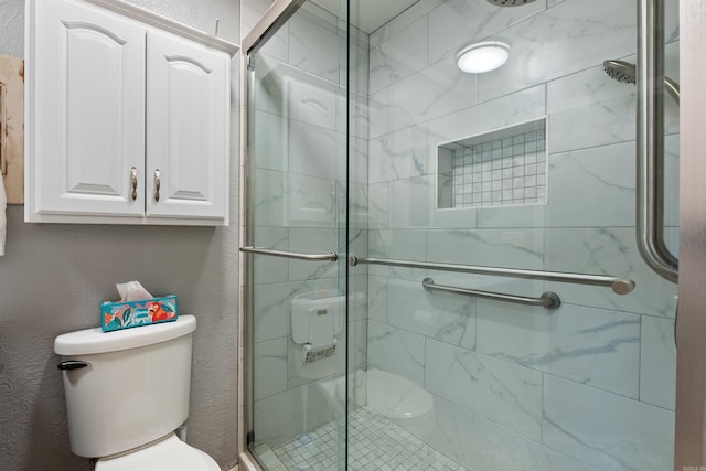 bathroom with walk in shower and toilet