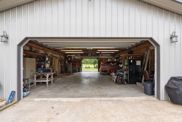 garage with black fridge