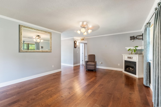 interior space with a textured ceiling, dark hardwood / wood-style flooring, and a wealth of natural light