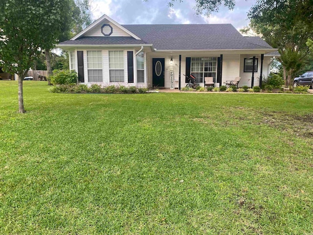 ranch-style house featuring a front lawn