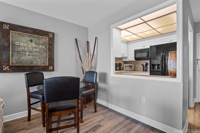 dining room with hardwood / wood-style floors