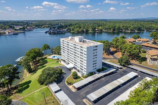 birds eye view of property with a water view