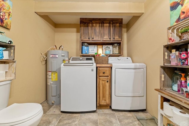 washroom featuring electric water heater and washing machine and clothes dryer