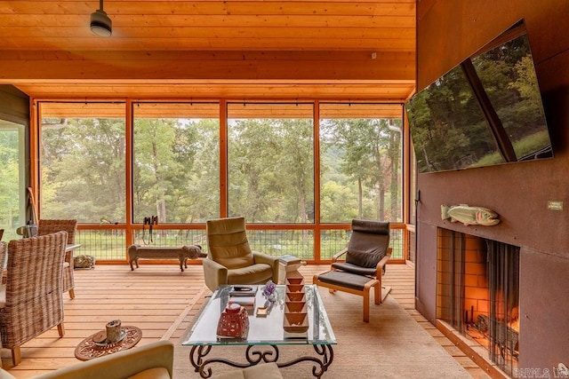 sunroom / solarium featuring wood ceiling