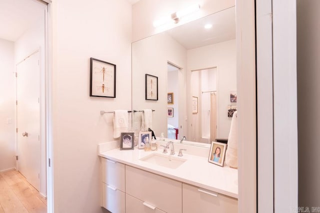 bathroom featuring vanity and hardwood / wood-style floors