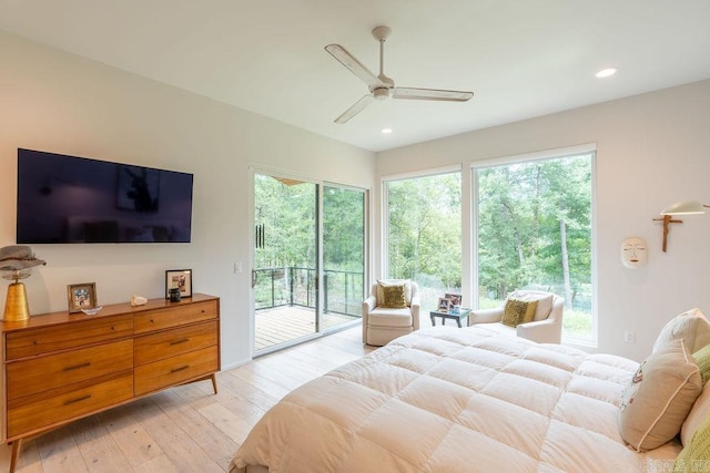 bedroom featuring access to outside, light hardwood / wood-style flooring, and ceiling fan