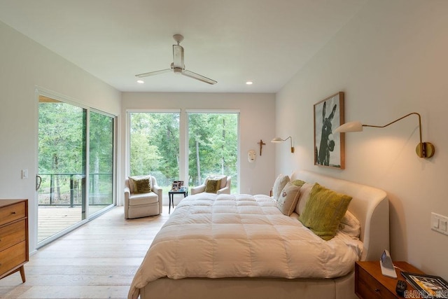 bedroom featuring ceiling fan, light hardwood / wood-style floors, access to exterior, and multiple windows