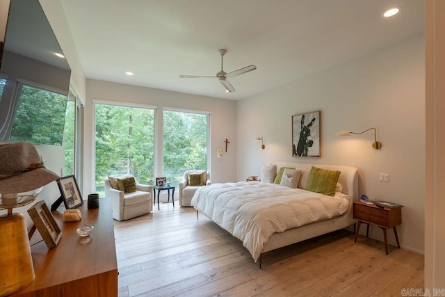 bedroom featuring light hardwood / wood-style flooring and ceiling fan