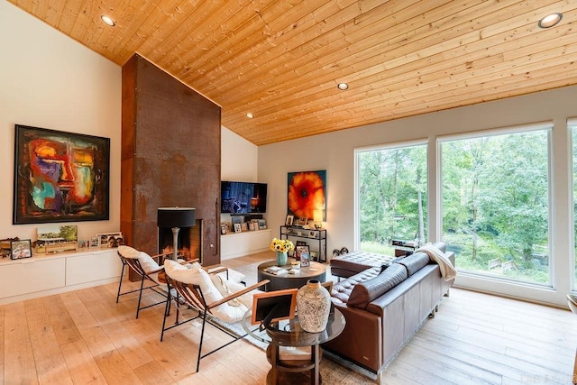 living room with wood ceiling, a fireplace, light hardwood / wood-style floors, and high vaulted ceiling