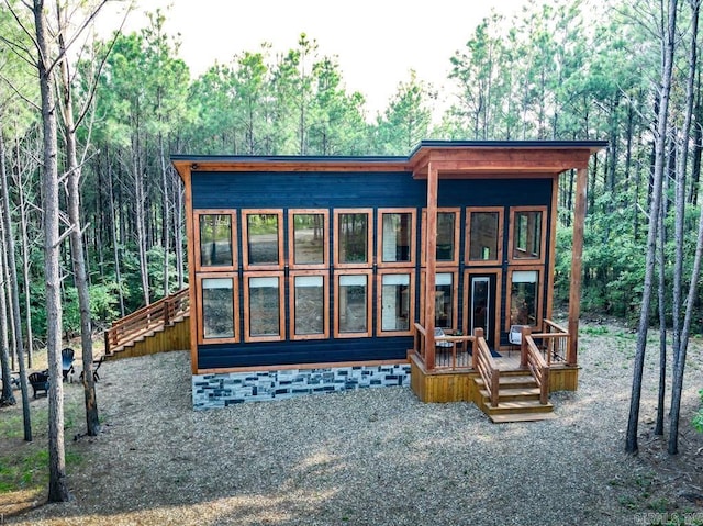 view of jungle gym with a sunroom