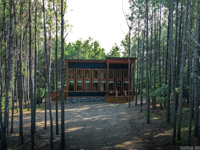 back of property with covered porch