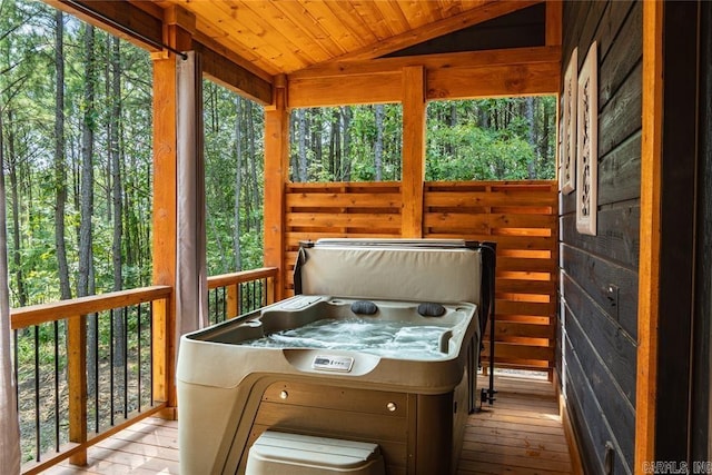 sunroom / solarium with vaulted ceiling, wooden ceiling, and a jacuzzi