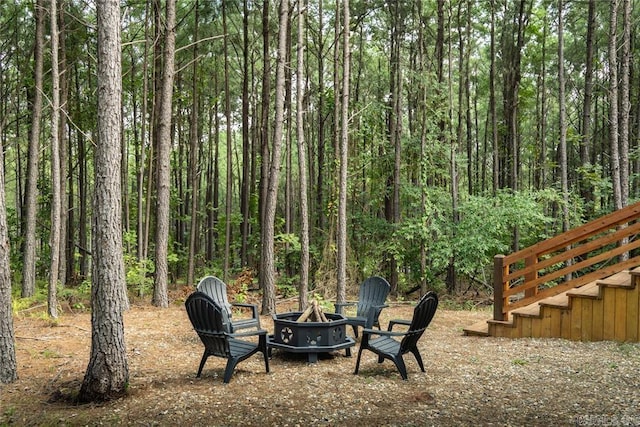 view of yard with an outdoor fire pit