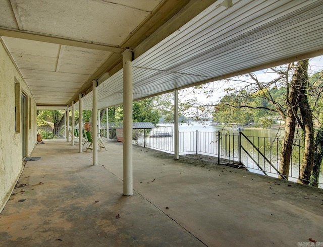 view of patio with a water view