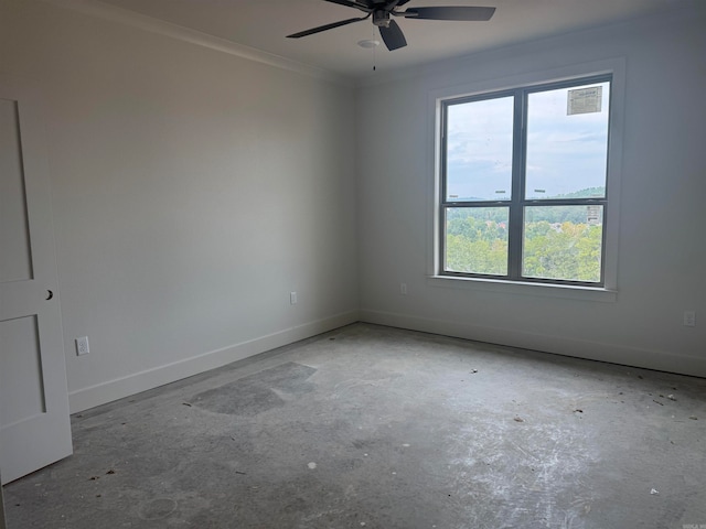 spare room with ornamental molding, ceiling fan, and a wealth of natural light