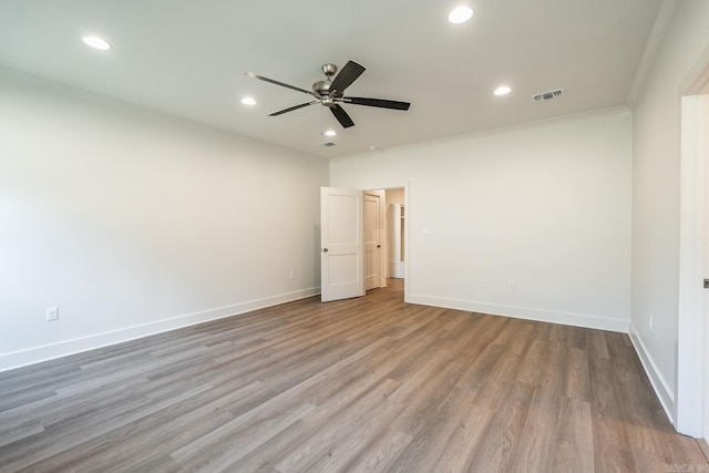 unfurnished bedroom featuring ceiling fan, ornamental molding, and light hardwood / wood-style floors