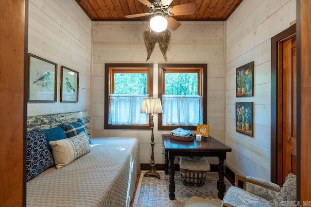 bedroom featuring wood ceiling and wooden walls