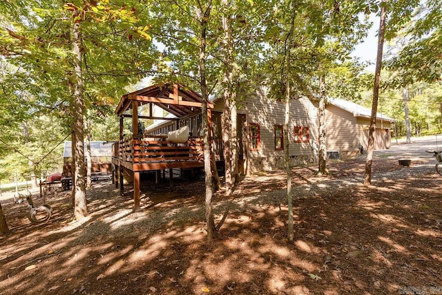 back of property with a wooden deck