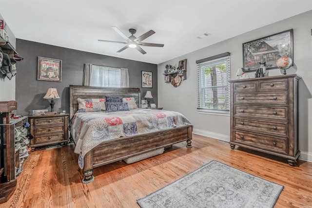 bedroom featuring hardwood / wood-style floors and ceiling fan