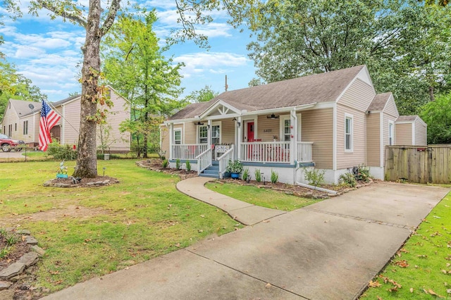 bungalow-style house with a front lawn and covered porch