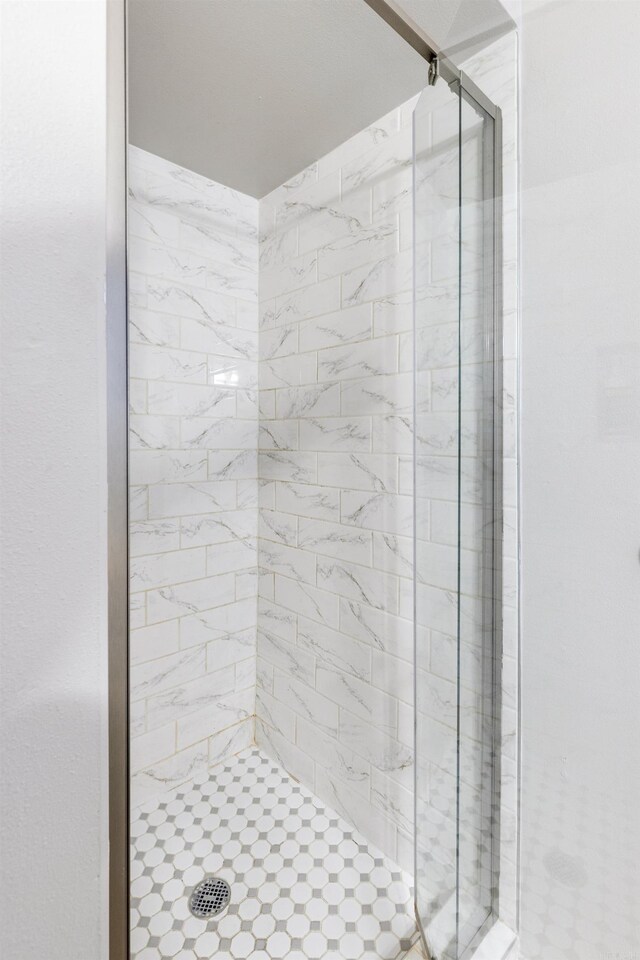 bathroom featuring an enclosed shower