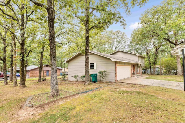 view of home's exterior with a yard and a garage