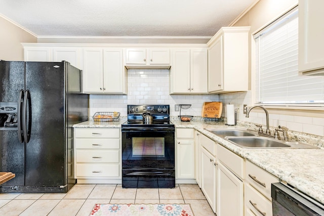 kitchen with light tile patterned flooring, tasteful backsplash, black appliances, crown molding, and sink