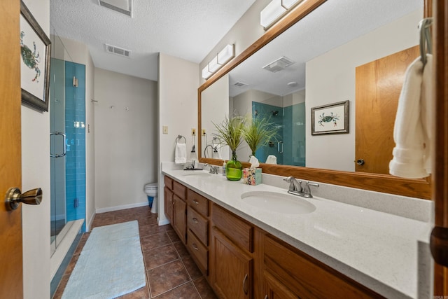 5371 Central Ave Unit 1B, Hot Springs, AR 72210 - full bathroom featuring a stall shower, toilet, double vanity, tile patterned floors, and a textured ceiling