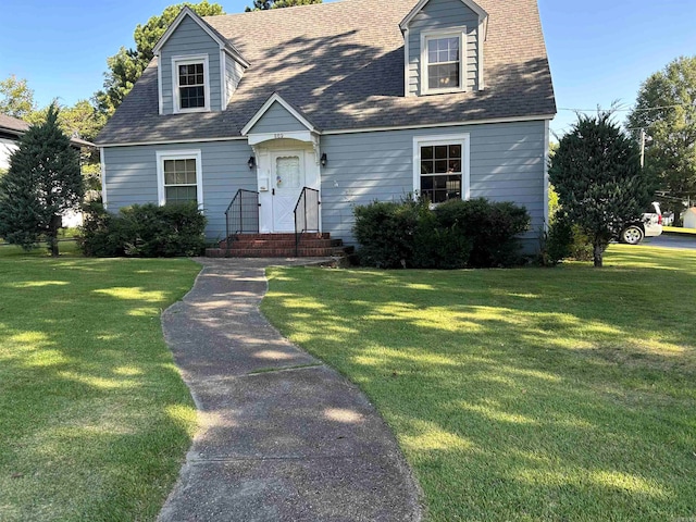 cape cod-style house featuring a front yard