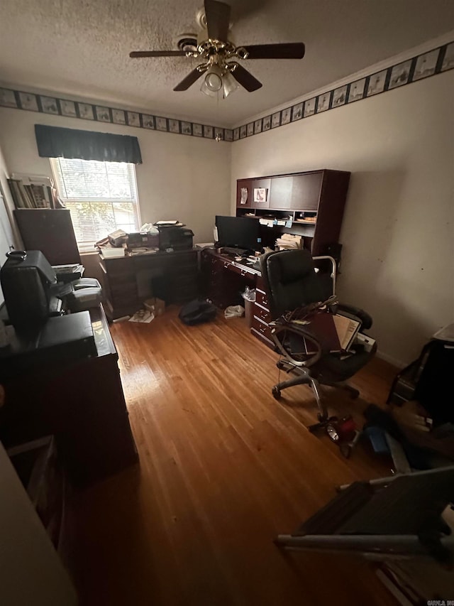 office with a textured ceiling, wood-type flooring, and ceiling fan