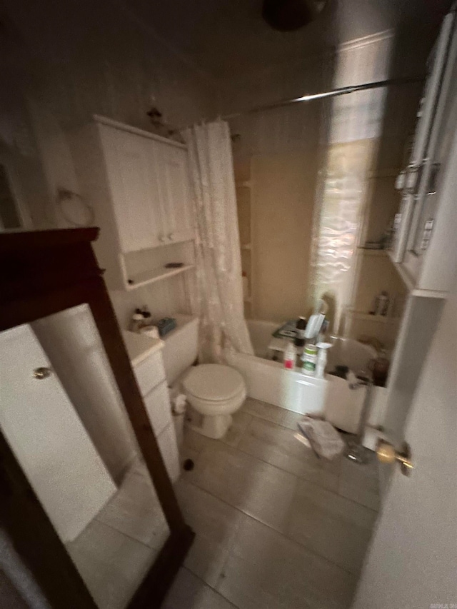 bathroom featuring shower / tub combo, toilet, and tile patterned floors