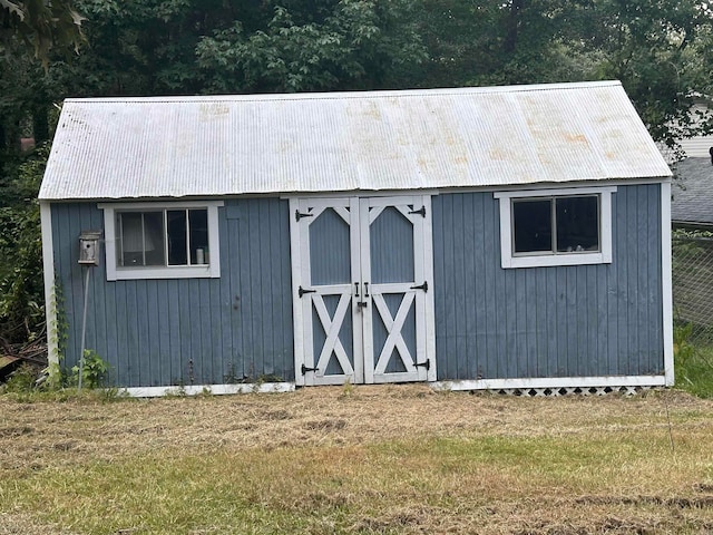 view of outdoor structure featuring a yard