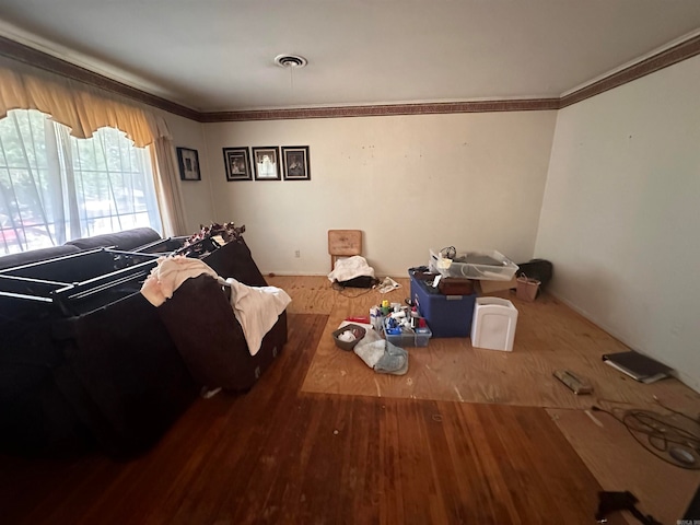 living room with ornamental molding and hardwood / wood-style floors