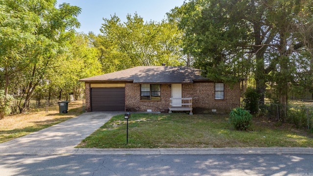 view of front of home with a garage and a front lawn