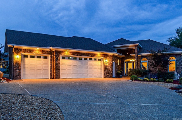 view of front of property with a garage