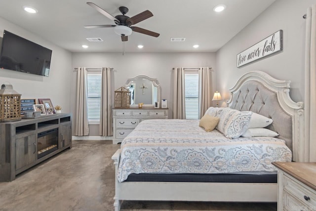 bedroom with multiple windows and ceiling fan