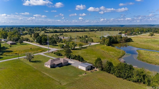 birds eye view of property with a rural view and a water view