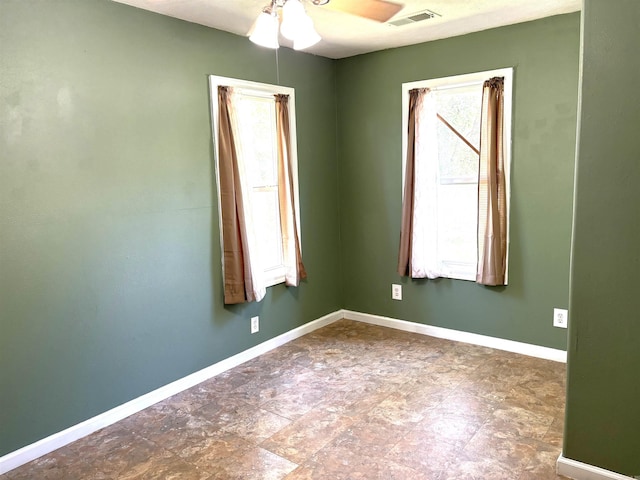 spare room with ceiling fan