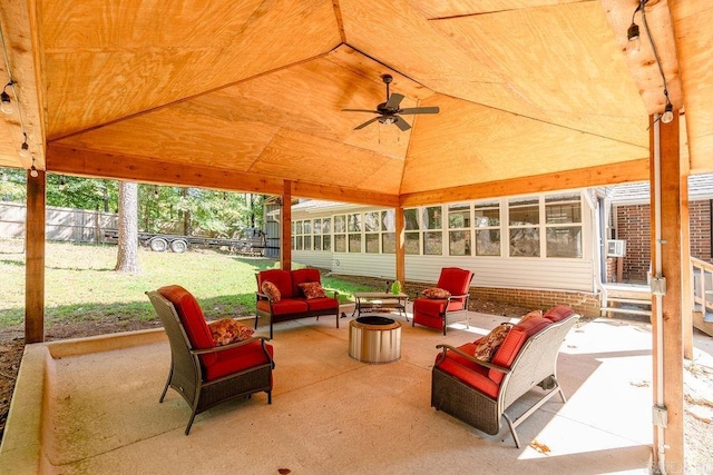 view of patio featuring an outdoor living space with a fire pit and ceiling fan