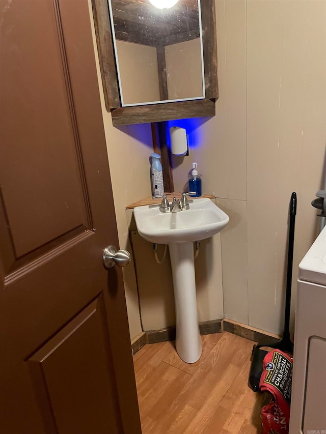 bathroom with wood-type flooring