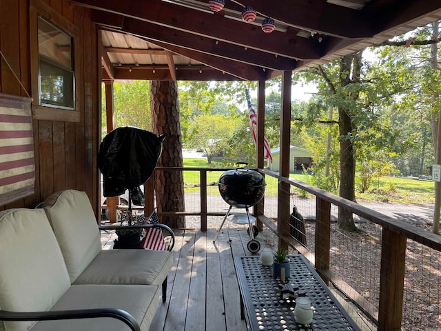 wooden deck with an outdoor hangout area