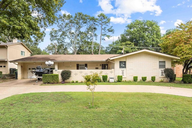 view of front of property with a garage and a front yard