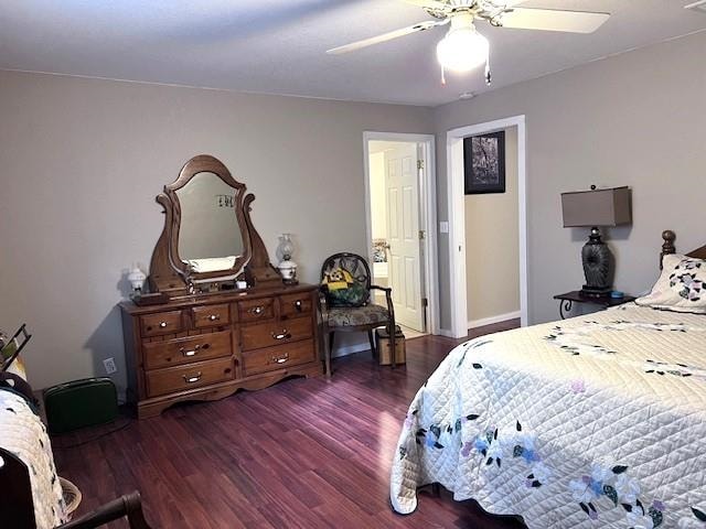 bedroom with ceiling fan and dark wood-type flooring