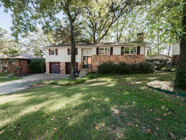 view of front of house with a garage and a front lawn