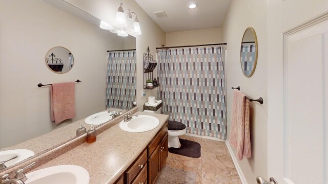 bathroom featuring a shower with shower curtain, vanity, and toilet