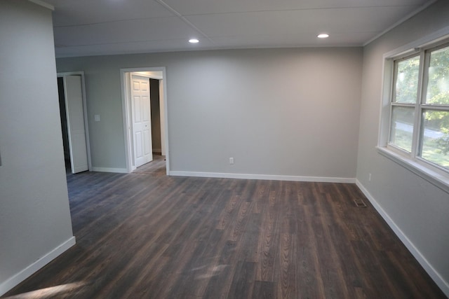 spare room with dark wood-type flooring