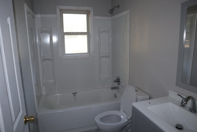 full bathroom with vanity, toilet, and washtub / shower combination