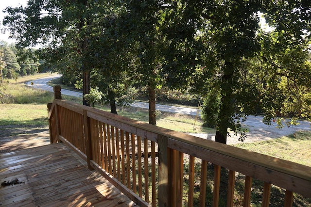 wooden deck featuring a water view